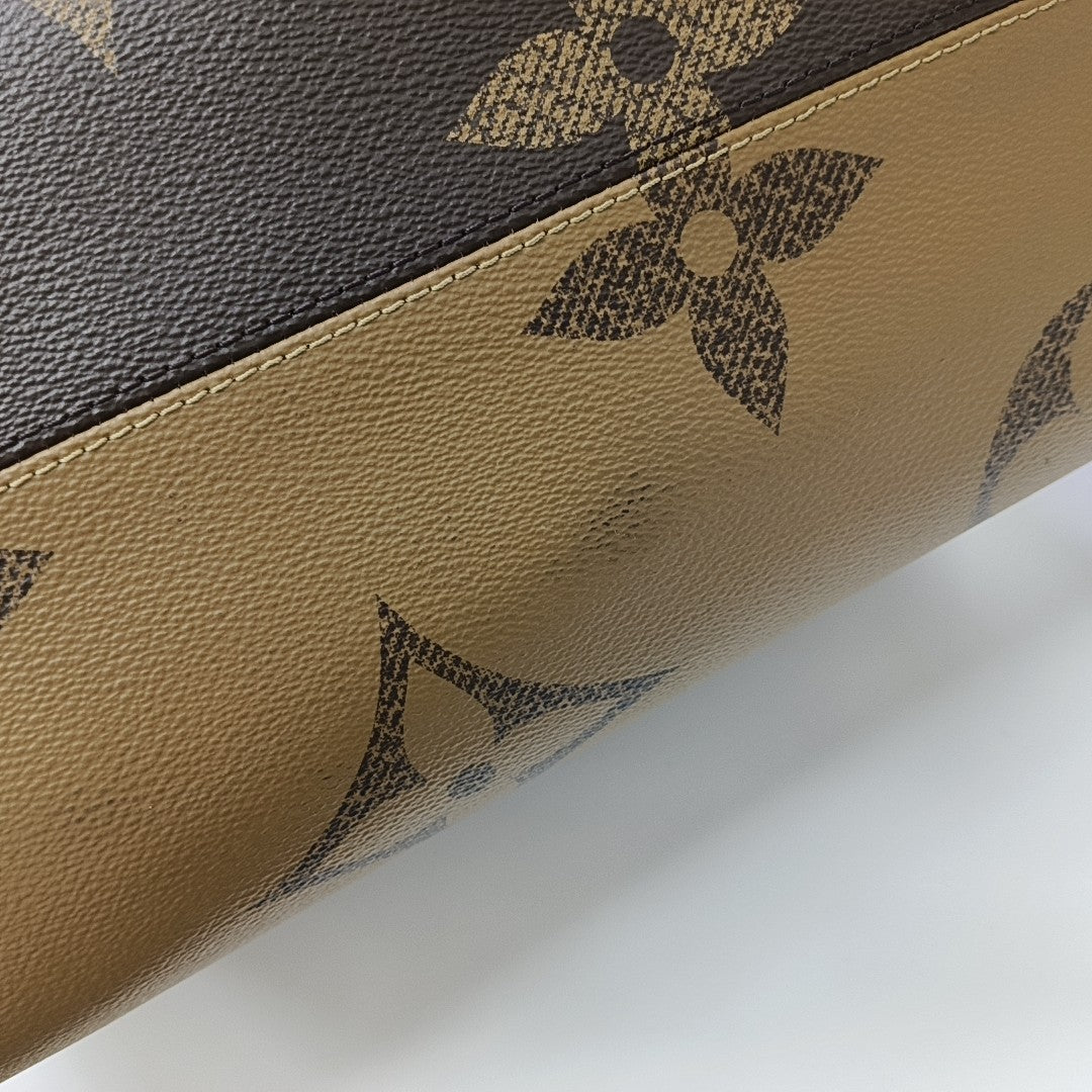 ONTHEGO GM Monogram Coated Canvas Brown
