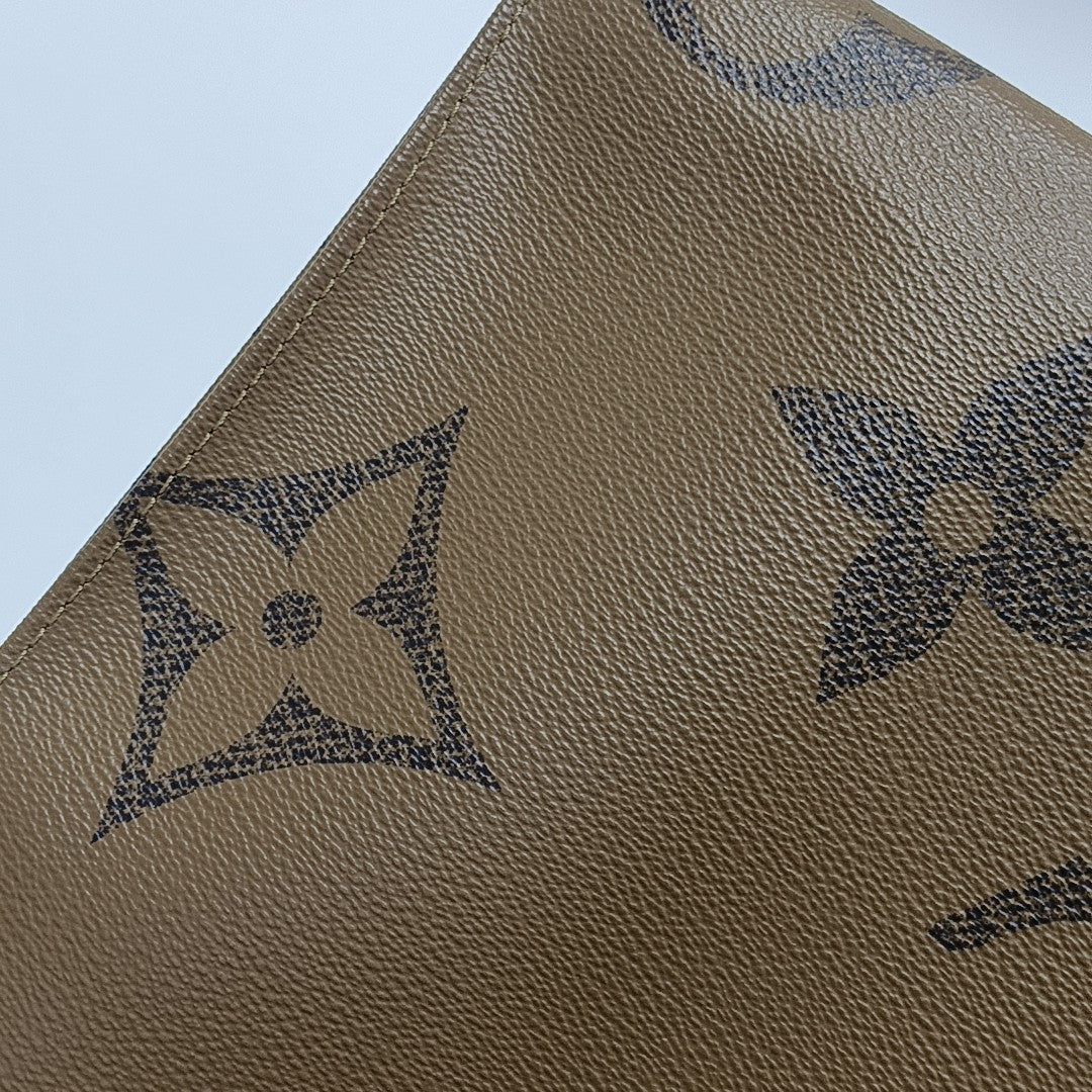 ONTHEGO MM Monogram Coated Canvas Brown