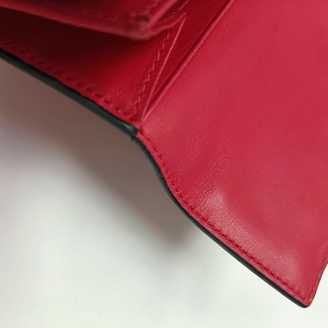 Authenticated pre-owned  Rockstud Calfskin Red Wallet - Wallet at Looply