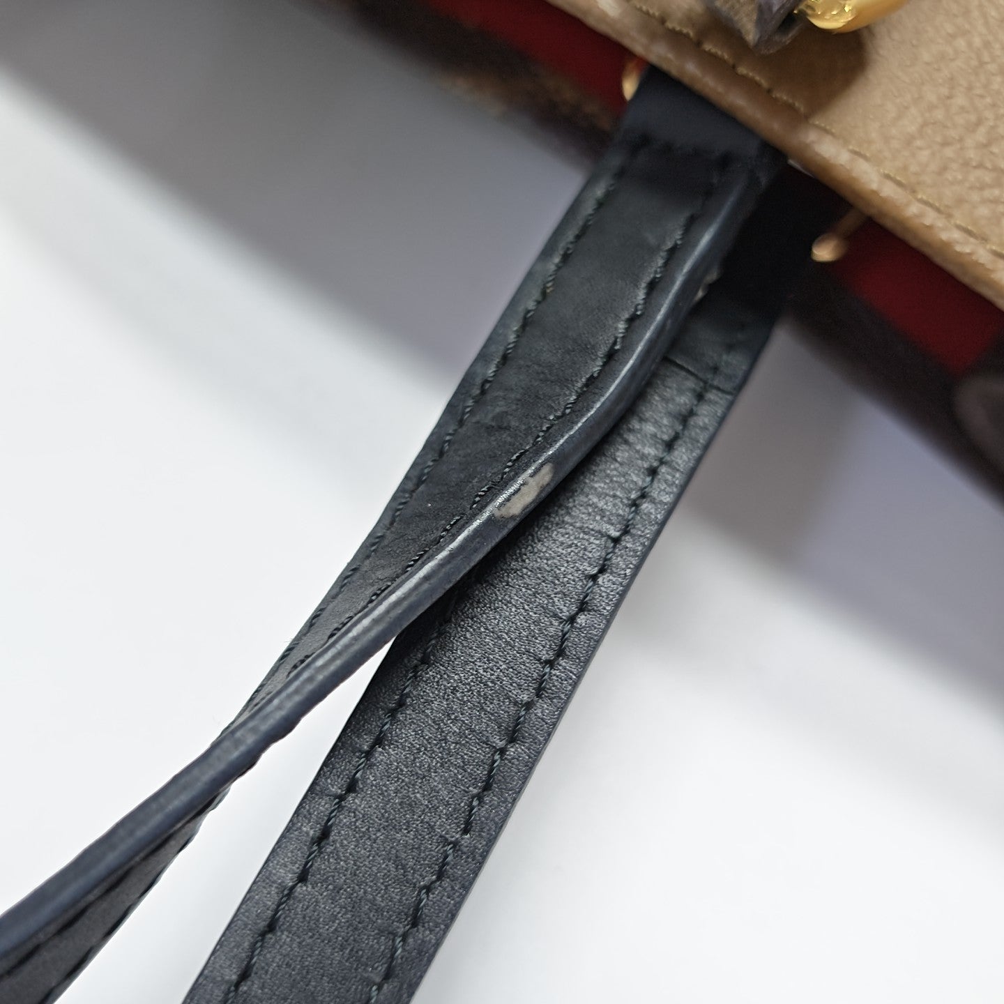 ONTHEGO MM Monogram Coated Canvas Brown