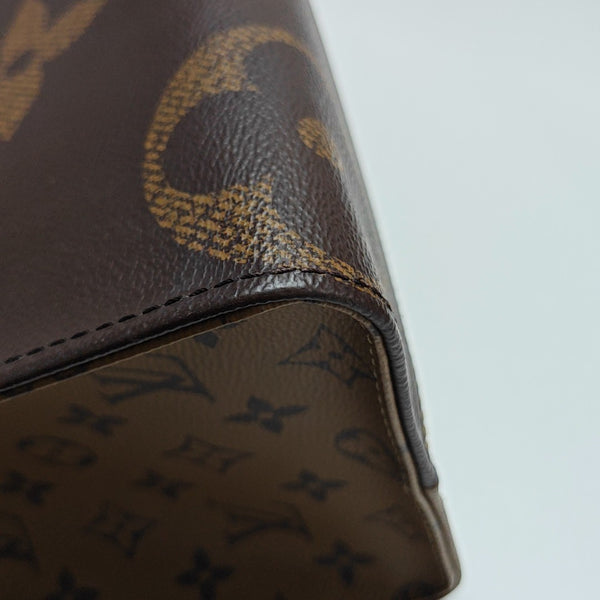 ONTHEGO MM Monogram Coated Canvas Brown