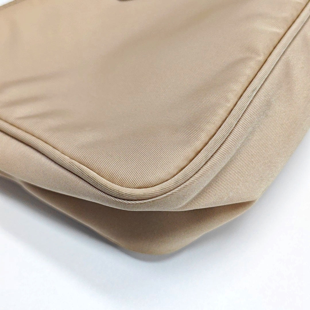 Authenticated pre-owned  Re-Edition2000 Mini Nylon Beige - Top Handle Bag at Looply