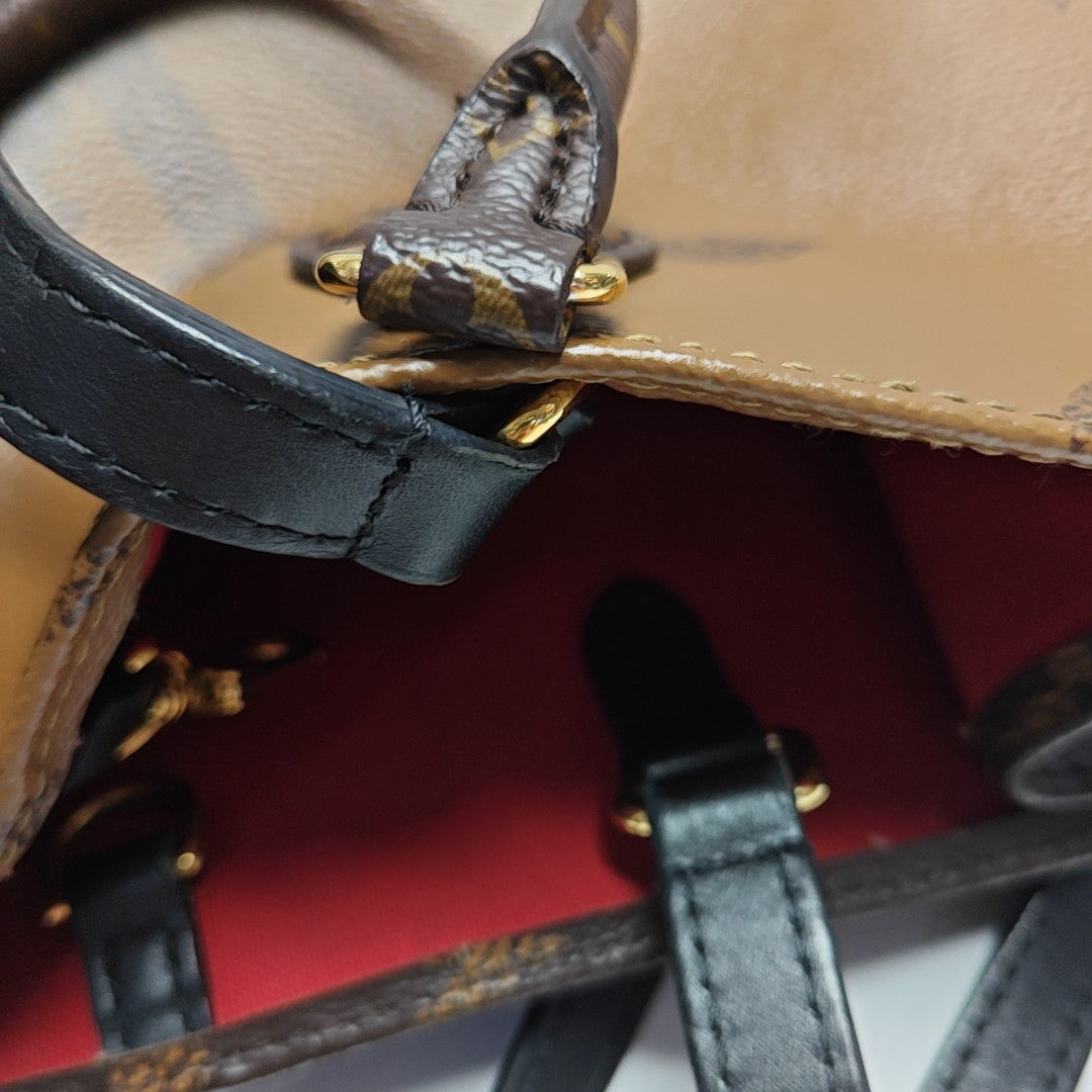 ONTHEGO MM Monogram Coated Canvas Brown