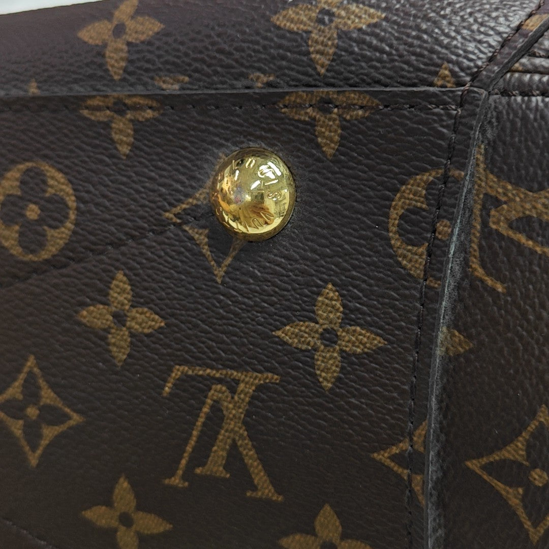 MONTAIGNE GM Monogram Coated Canvas Brown
