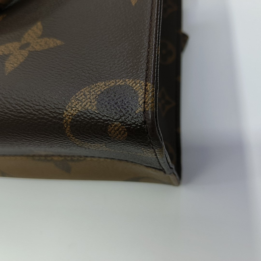 ONTHEGO PM Monogram Coated Canvas Brown