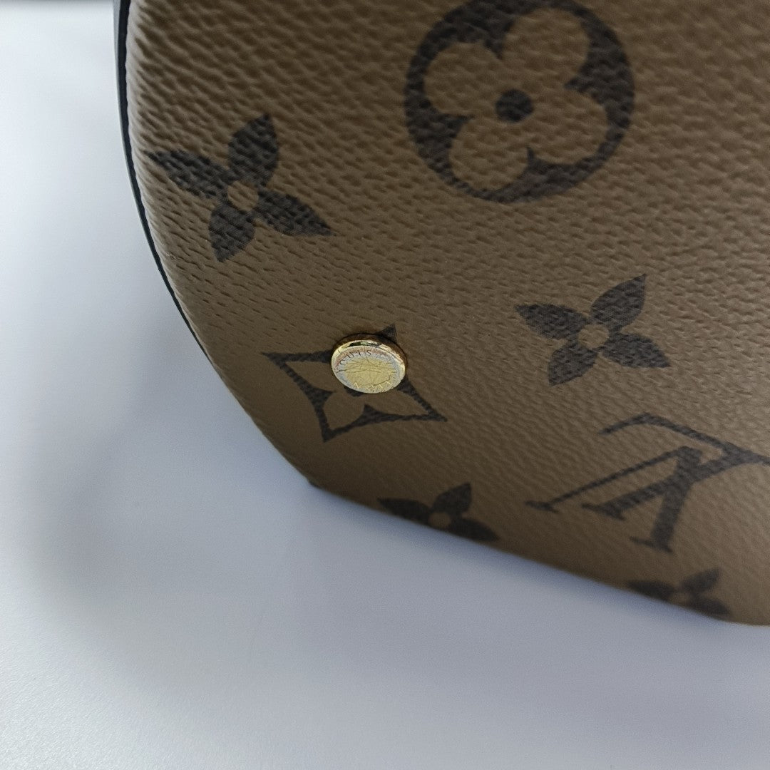 CANNES PM Monogram Coated Canvas Brown