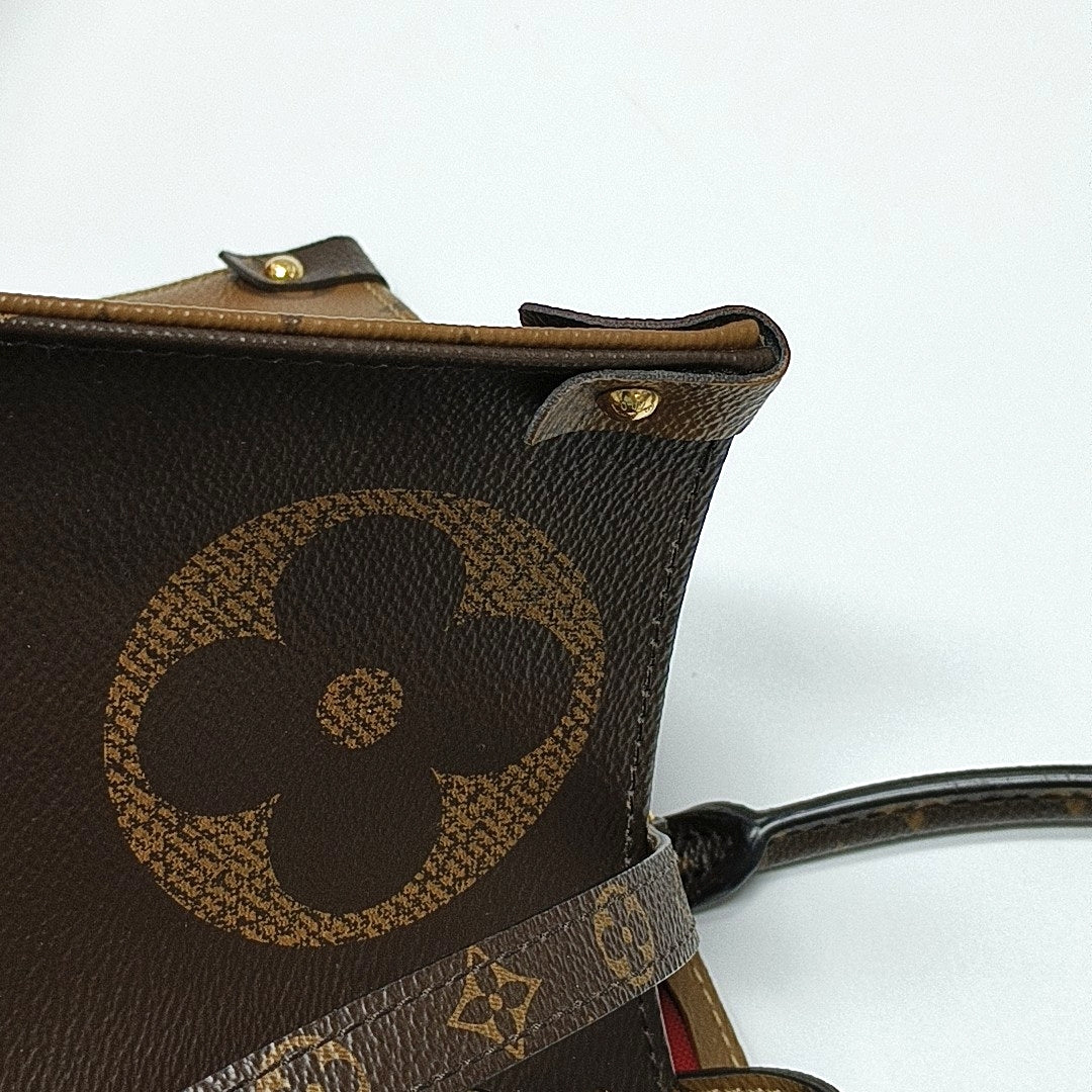 ONTHEGO GM Monogram Coated Canvas Brown