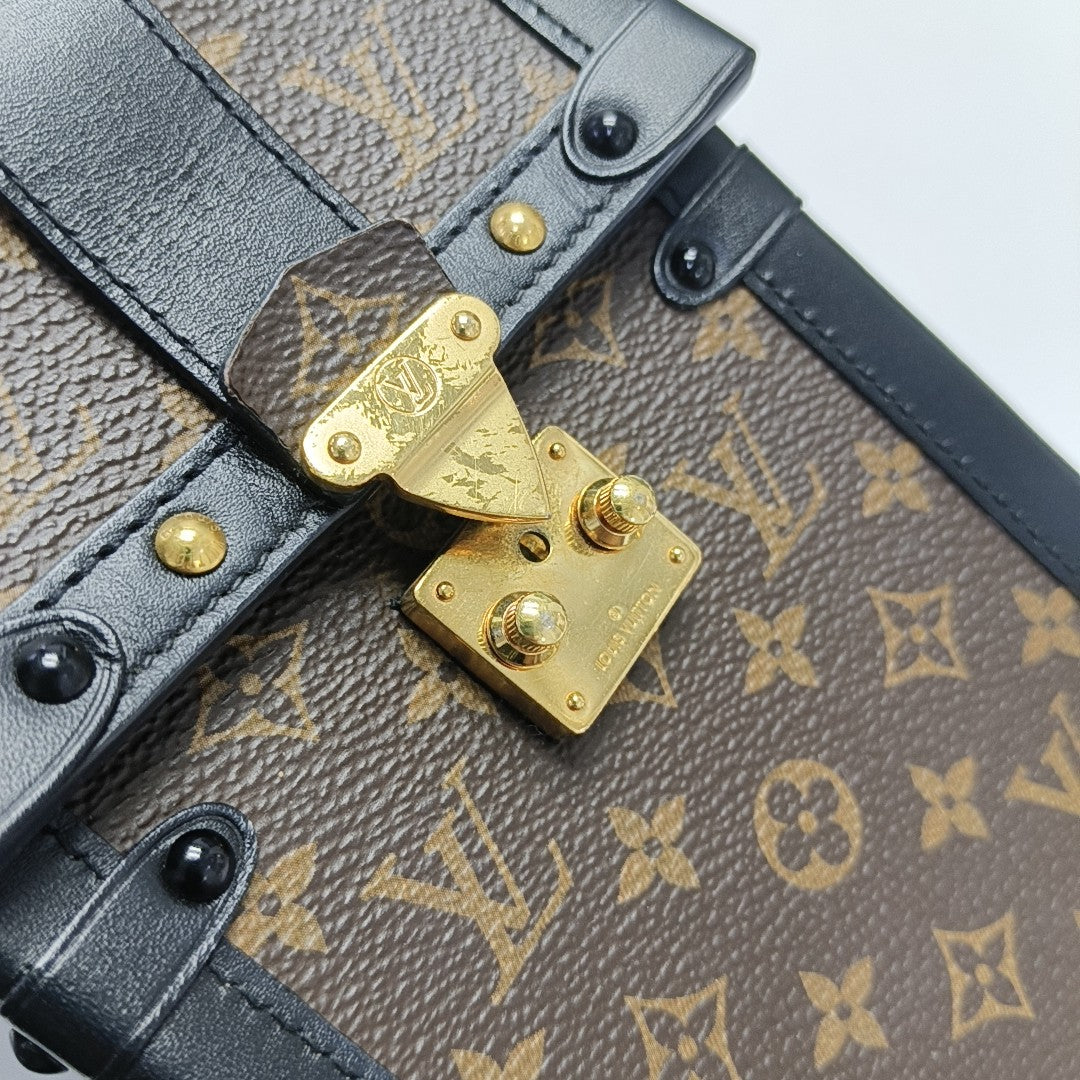 TRUNK Monogram Coated Canvas Brown