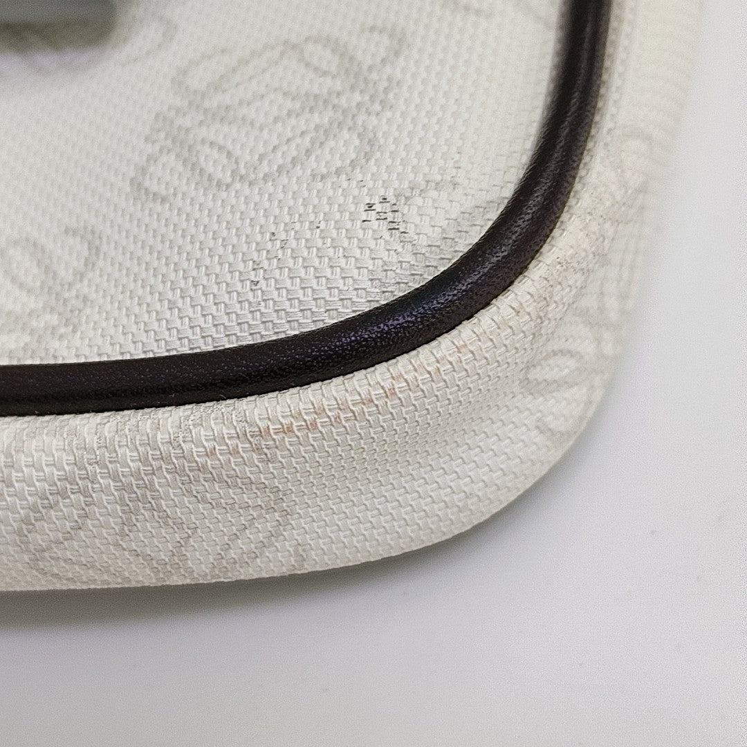 Monogram Coated Canvas Clutch White