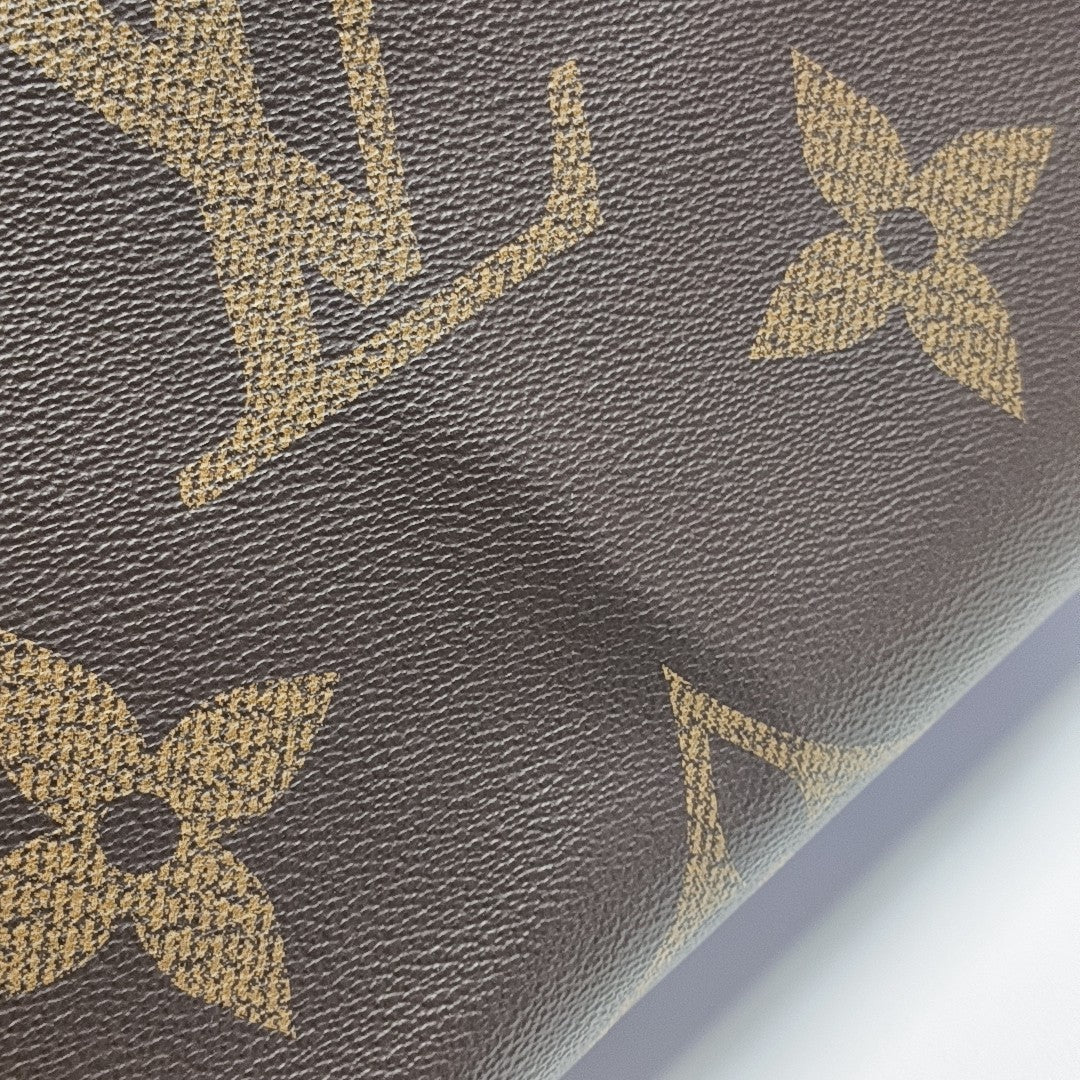 ONTHEGO MM Monogram Coated Canvas Brown