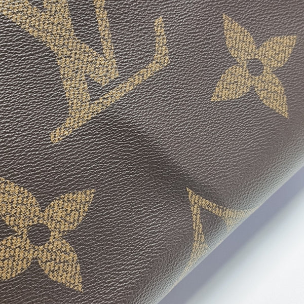 ONTHEGO MM Monogram Coated Canvas Brown