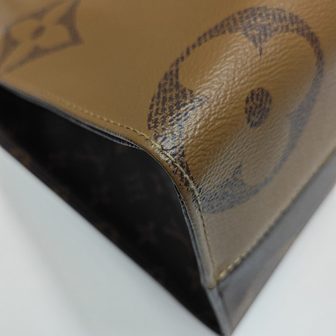 ONTHEGO MM Monogram Coated Canvas Brown