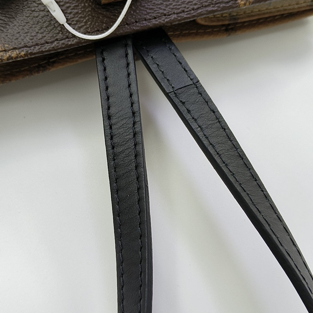 ONTHEGO MM Monogram Coated Canvas Brown