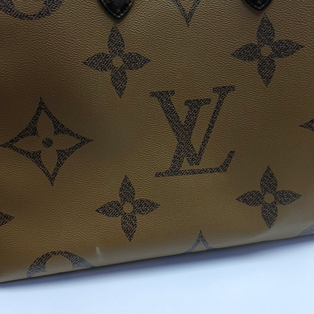 ONTHEGO GM Monogram Coated Canvas Brown