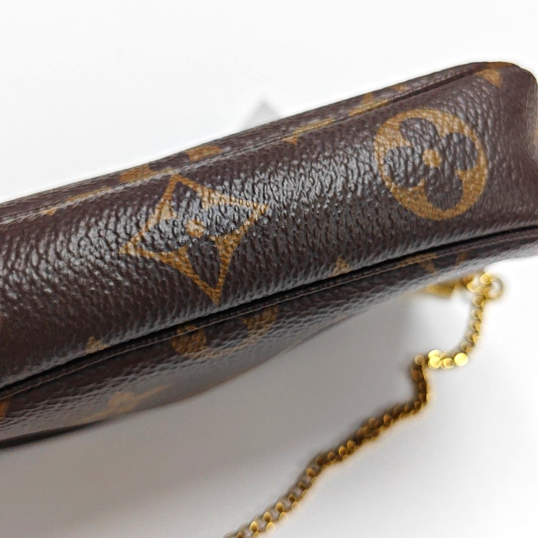 Authenticated pre-owned  ACCESSOIRES Mini Monogram Coated Canvas Brown - Top Handle Bag at Looply