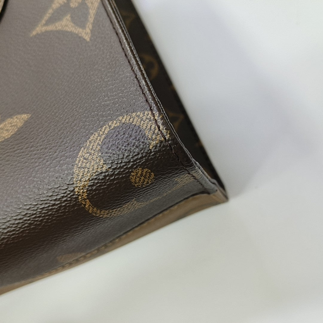 ONTHEGO PM Monogram Coated Canvas Brown
