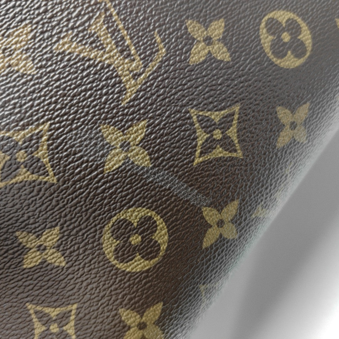 MONTAIGNE GM Monogram Coated Canvas Brown