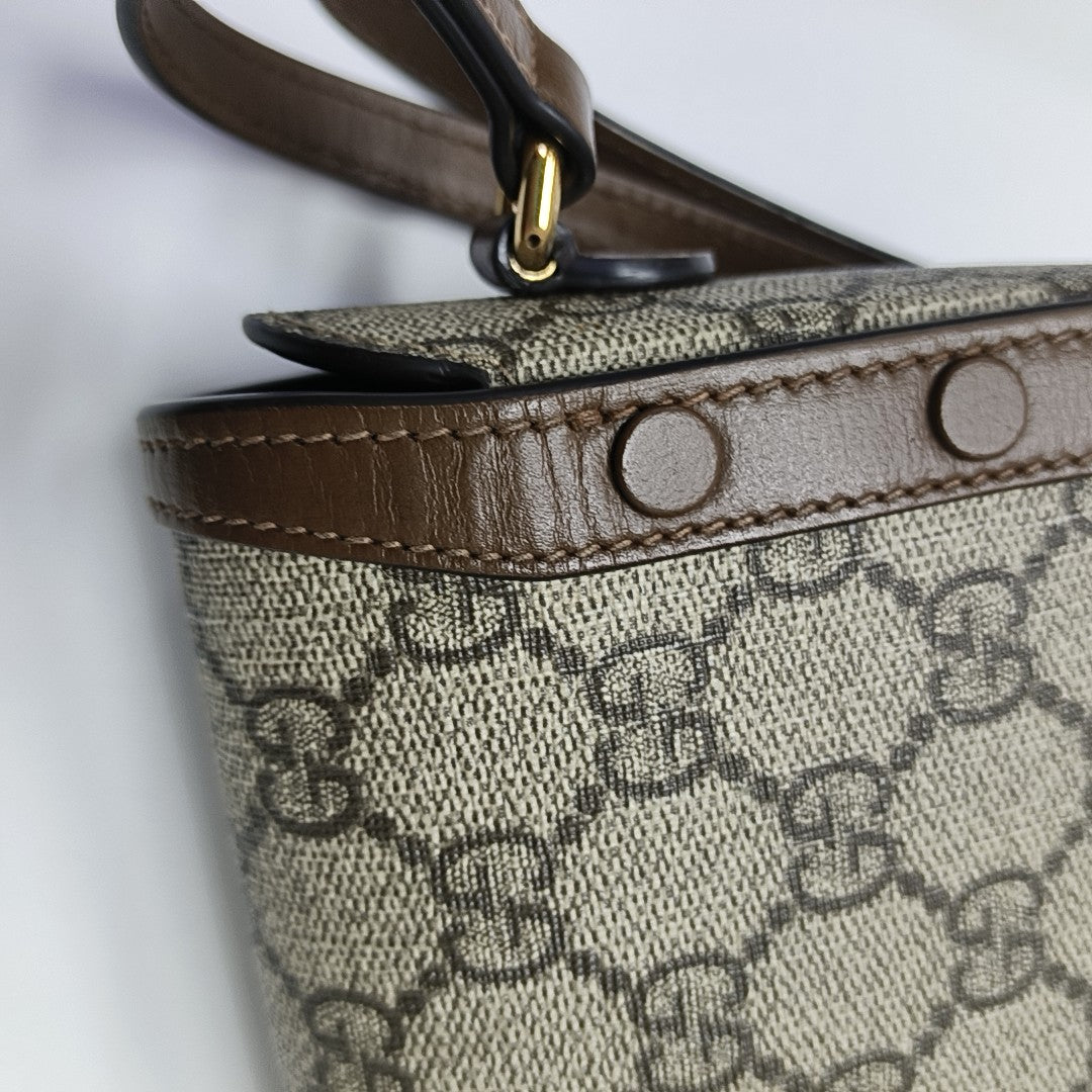Authenticated pre-owned  Horsebit 1955 Mini Monogram Coated Canvas Beige - Shoulder Bag at Looply