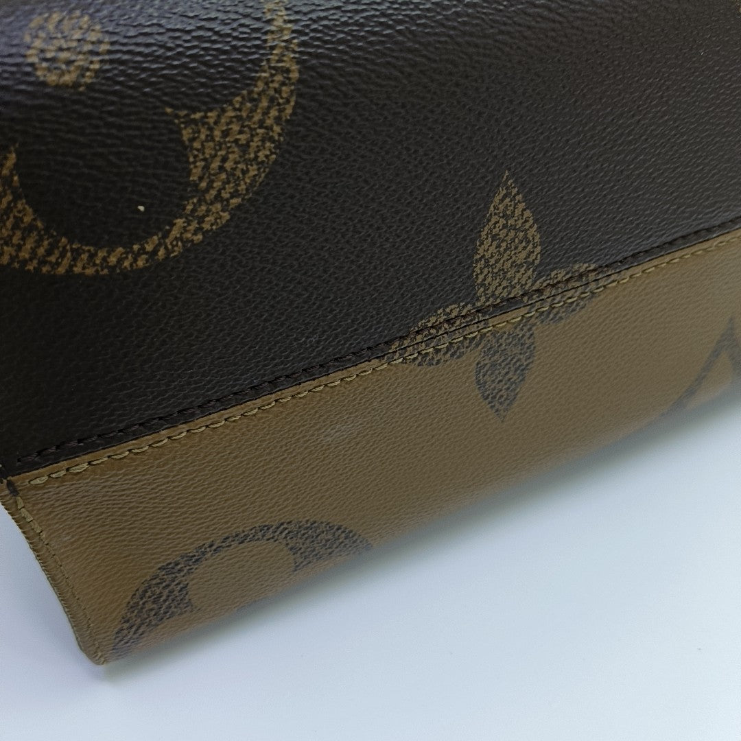 ONTHEGO MM Monogram Coated Canvas Brown