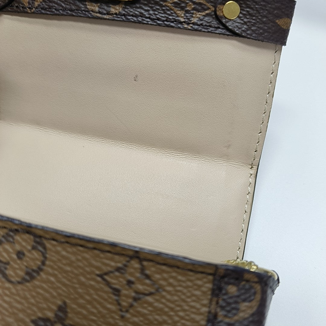 TRUNK Monogram Coated Canvas Brown