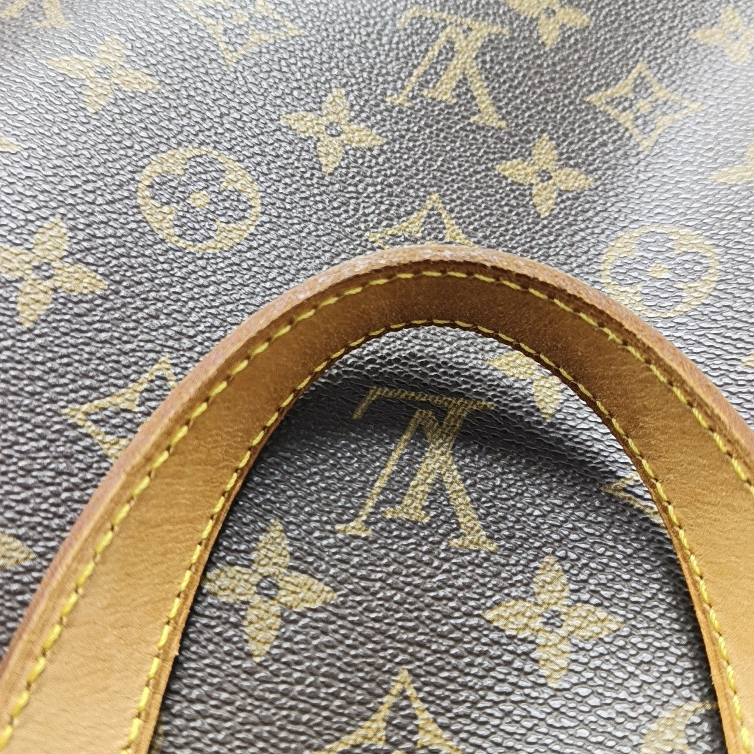 EXCURSION Monogram Coated Canvas Brown