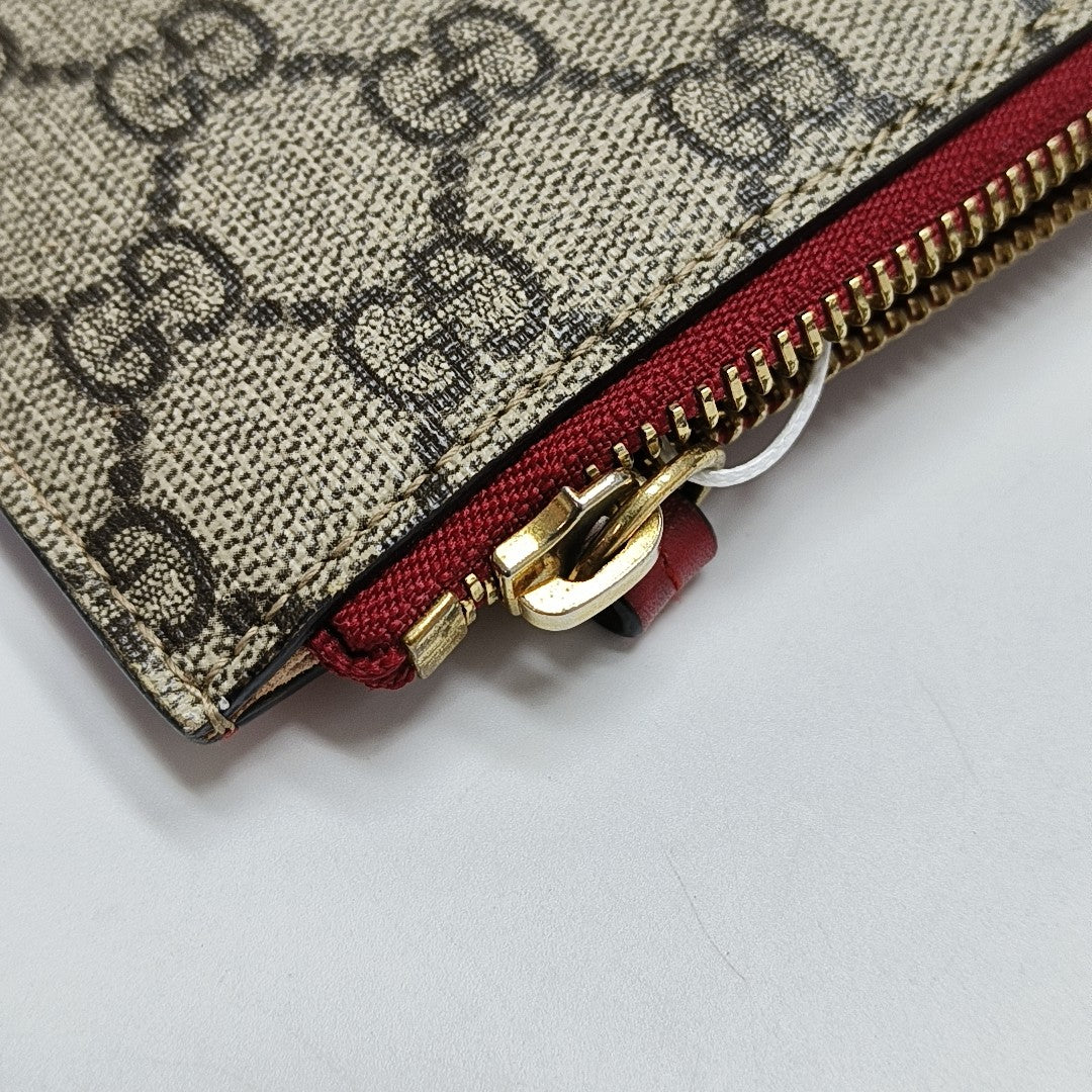 Monogram Coated Canvas Clutch Beige