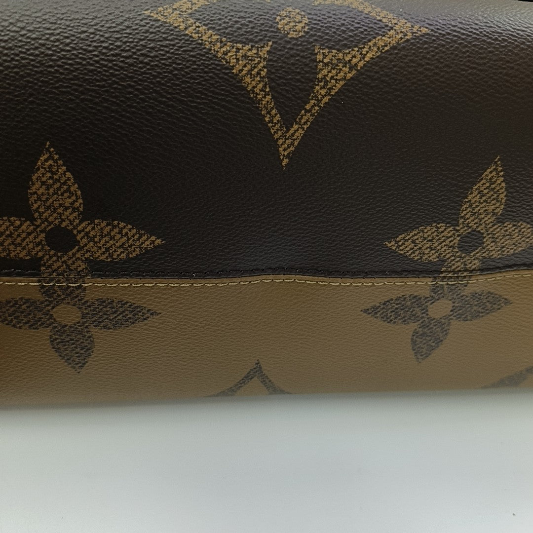ONTHEGO GM Monogram Coated Canvas Brown