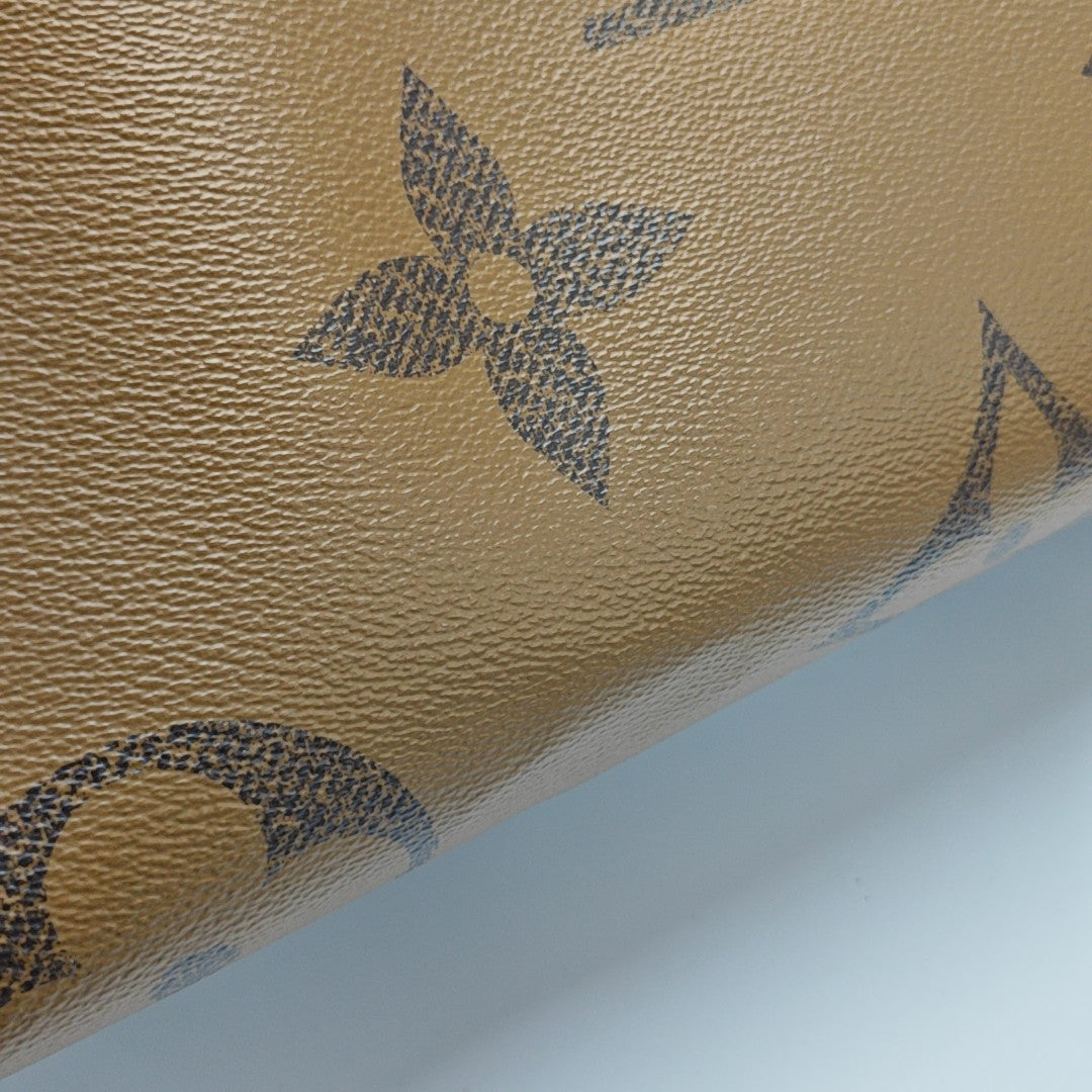 ONTHEGO MM Monogram Coated Canvas Brown