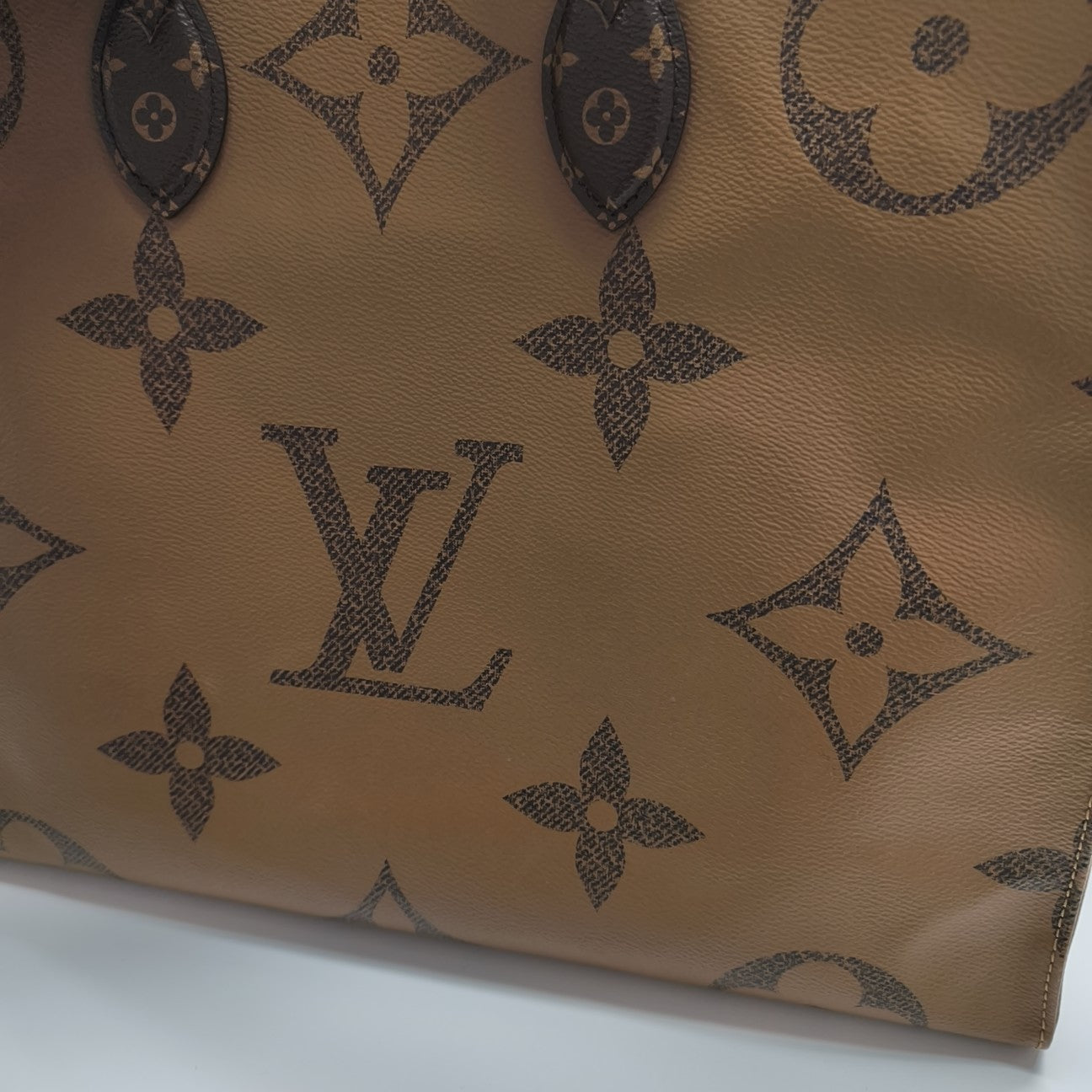 ONTHEGO GM Monogram Coated Canvas Brown