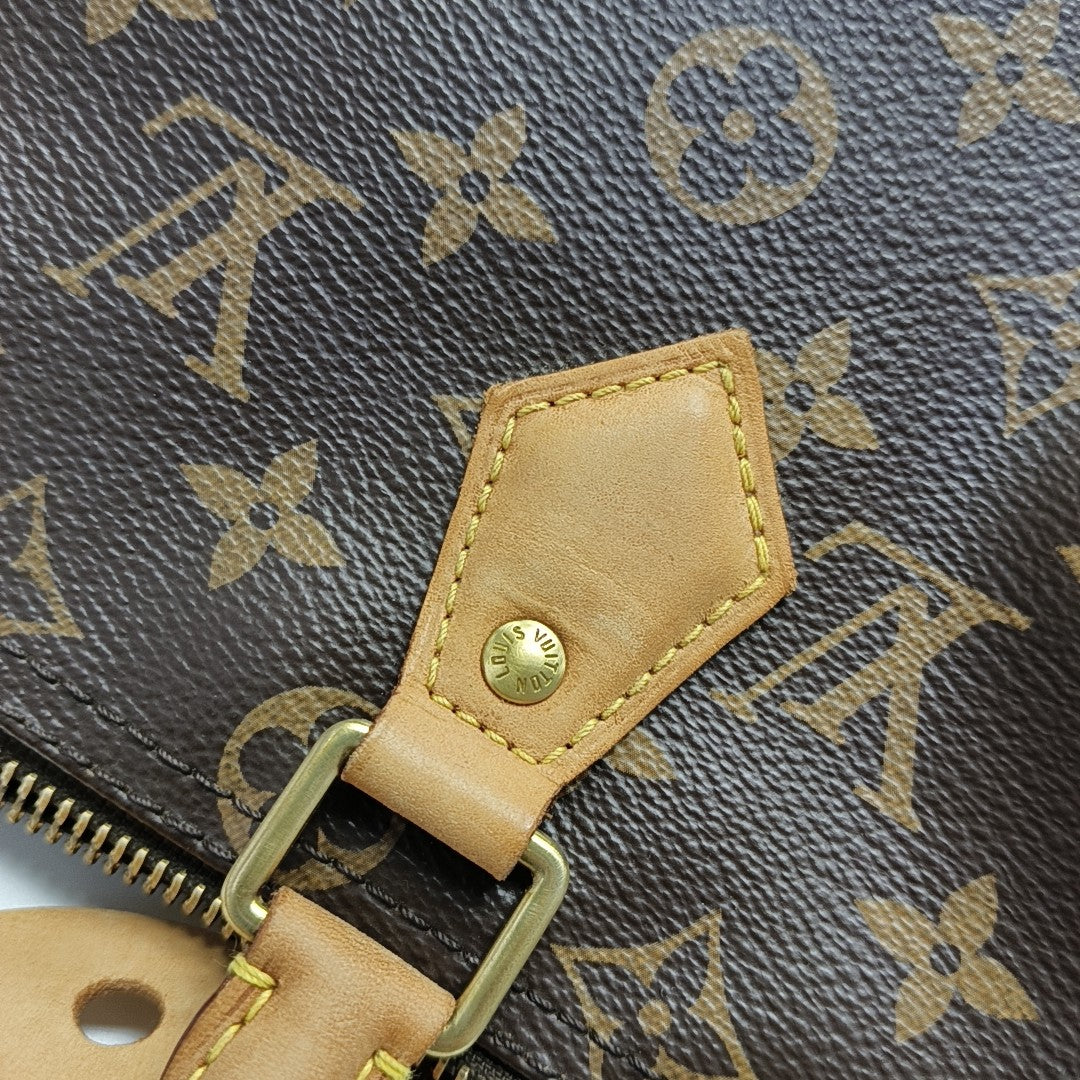 SPEEDY 25 Monogram Coated Canvas Brown