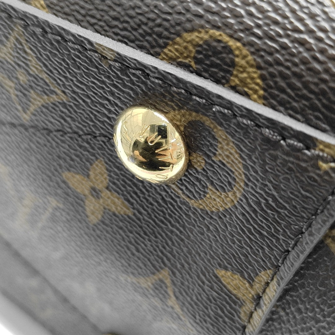 MONTAIGNE GM Monogram Coated Canvas Brown