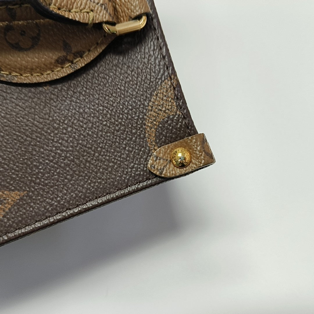 ONTHEGO PM Monogram Coated Canvas Brown