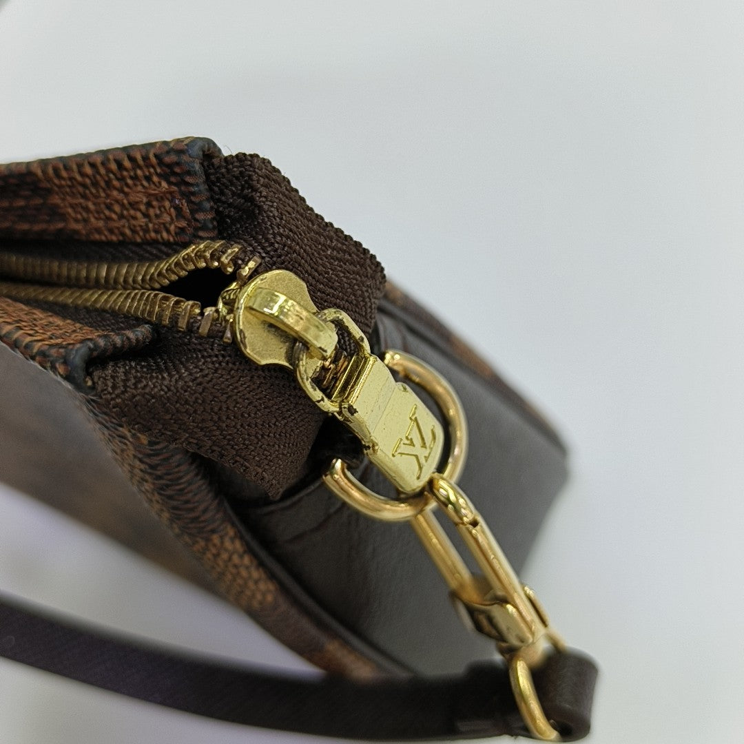 TROUSSE MAKE UP Damier Ebene Coated Canvas Brown