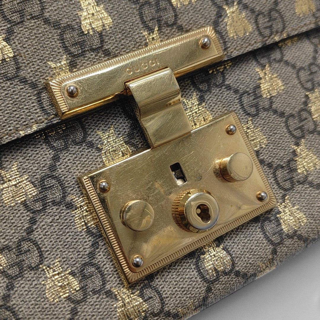 Padlock Small Monogram Coated Canvas Beige
