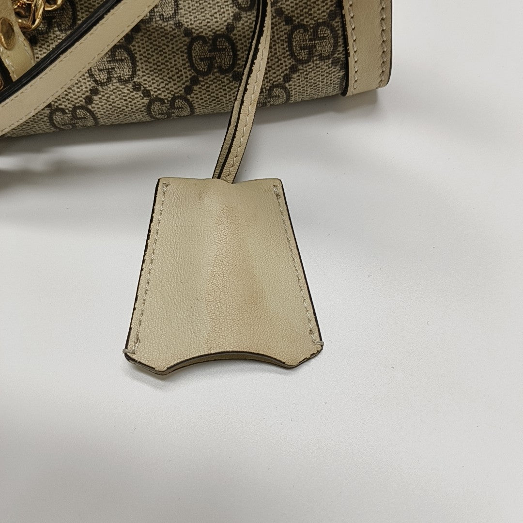 Padlock Small Monogram Coated Canvas Beige