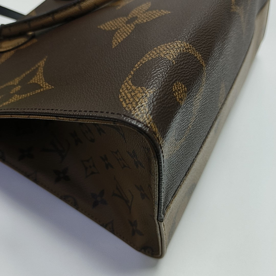 ONTHEGO MM Monogram Coated Canvas Brown