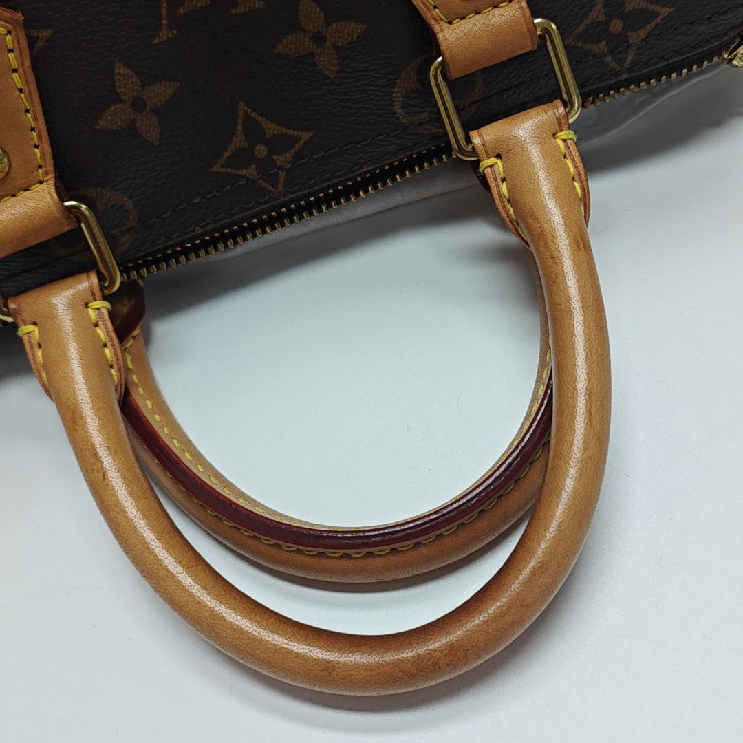 SPEEDY 25 Monogram Coated Canvas Brown