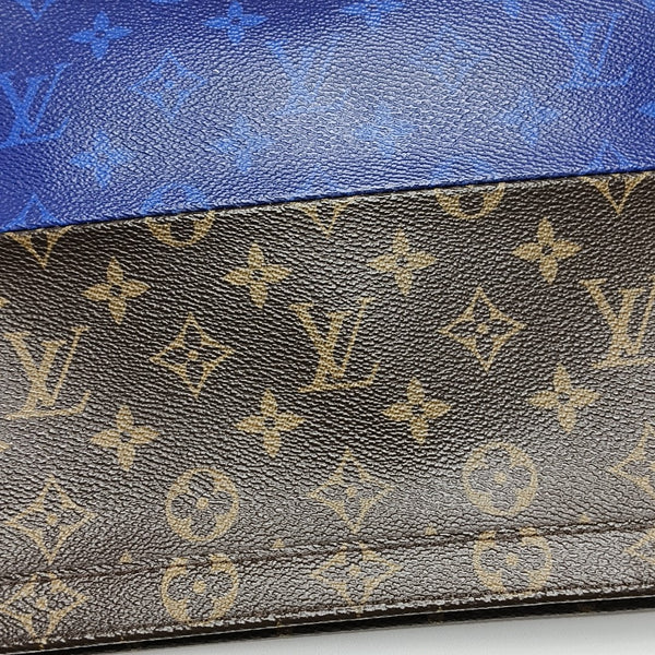 Pochette Voyag MM Monogram Coated Canvas Blue