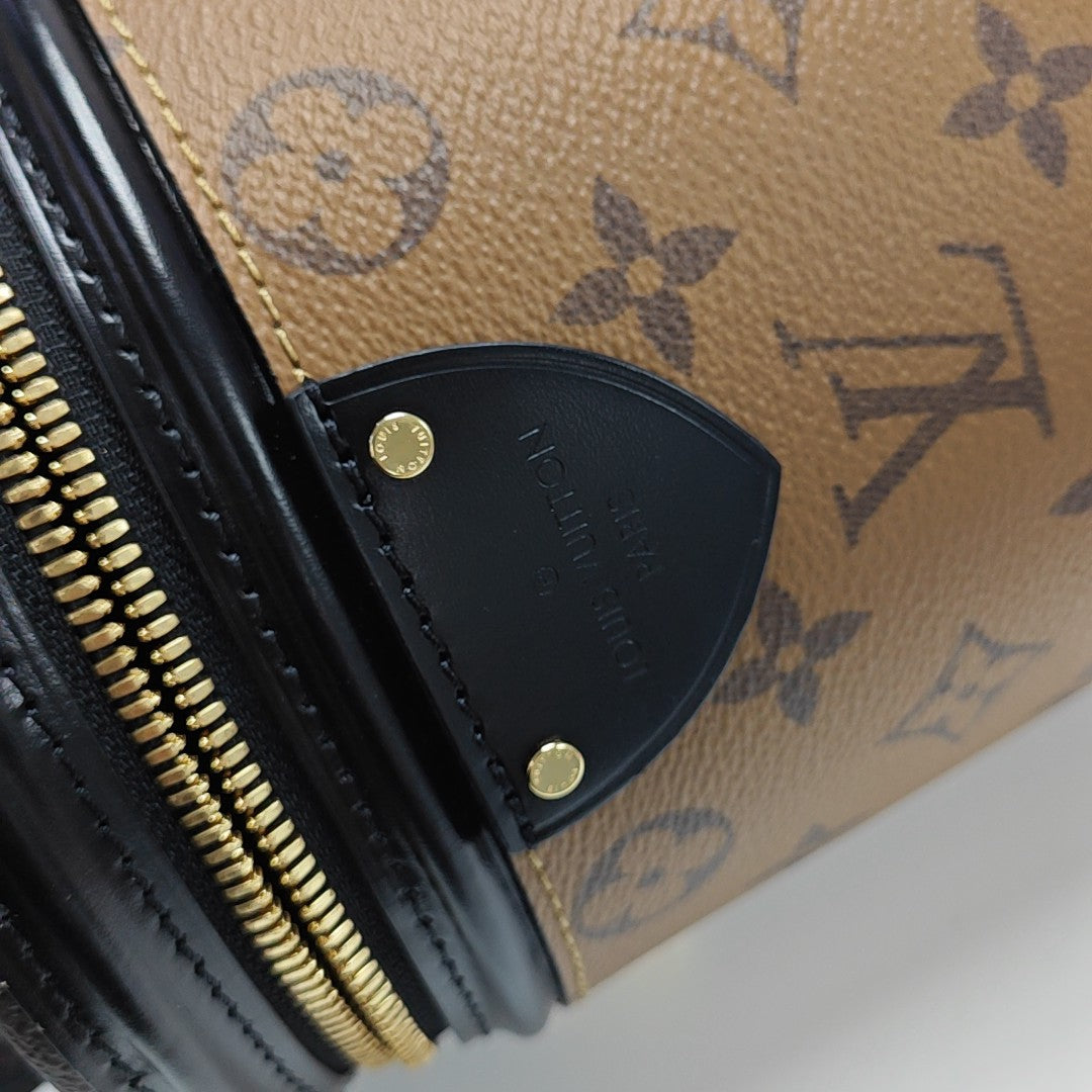 CANNES PM Monogram Coated Canvas Brown