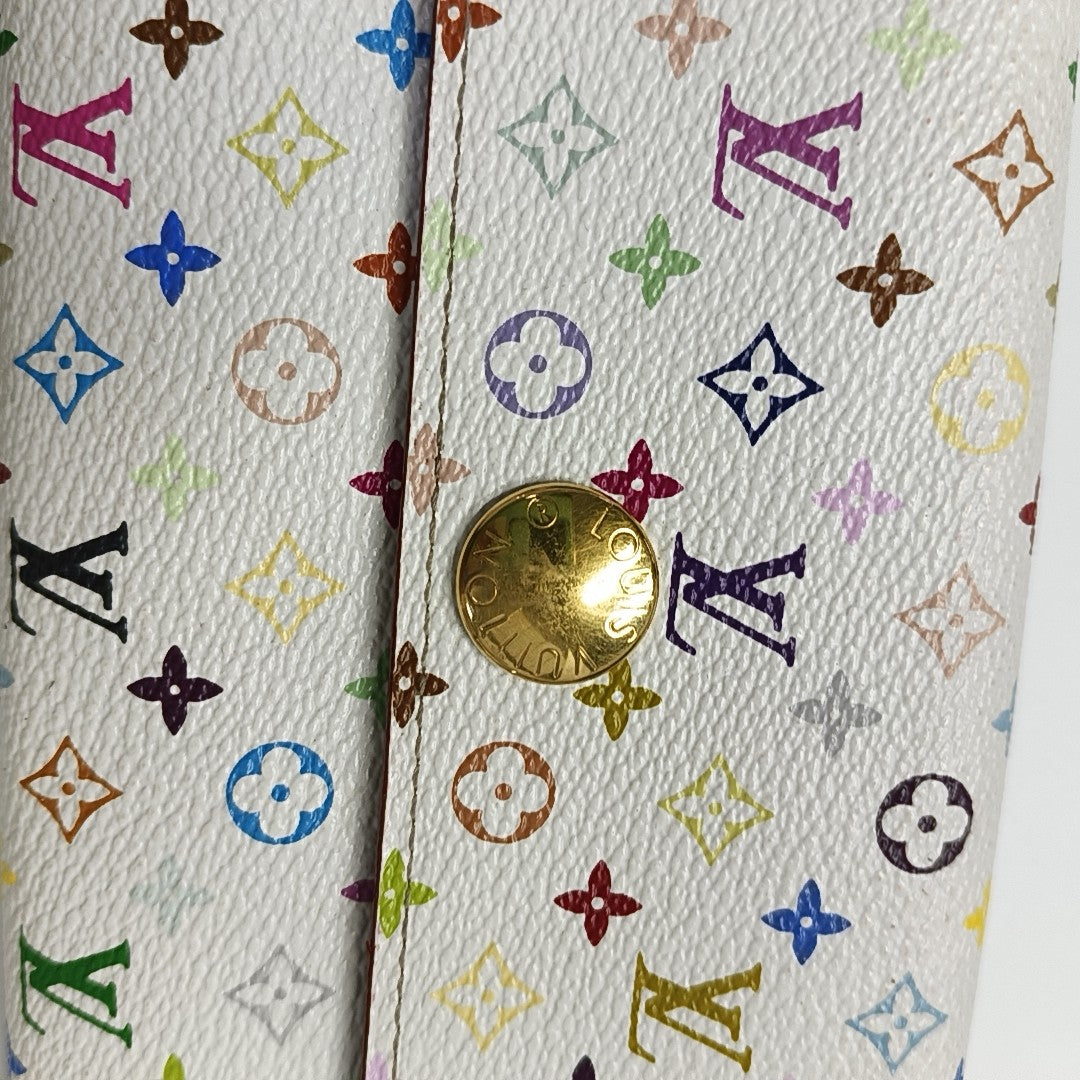 Monedero Monogram en lona revestida blanca