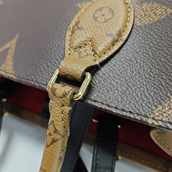 ONTHEGO MM Monogram Coated Canvas Brown