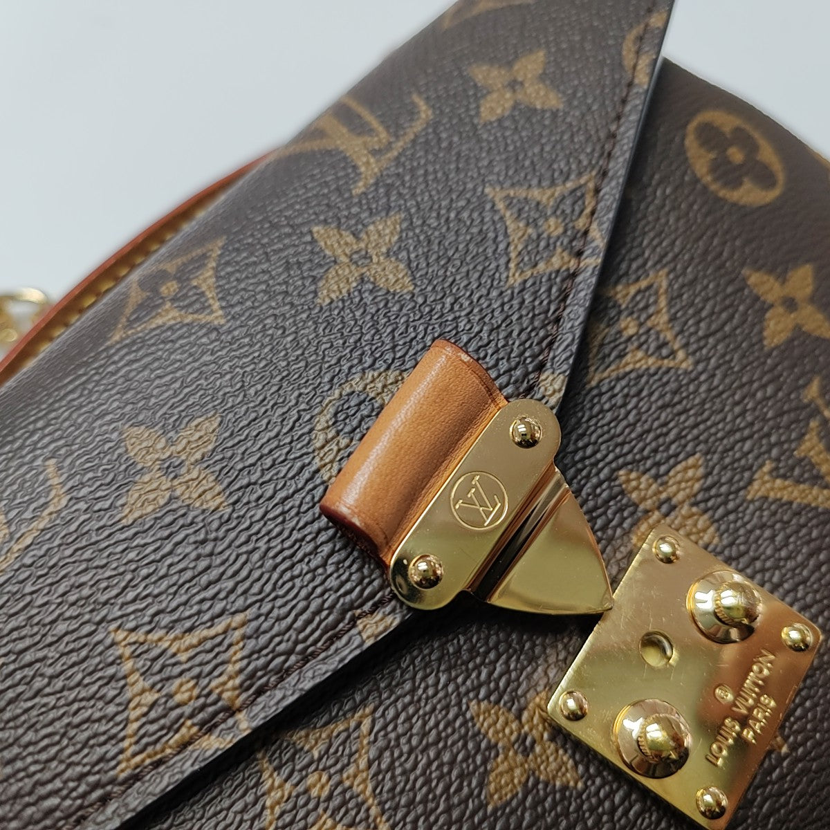MÉTIS EAST WEST Monogram Coated Canvas Brown