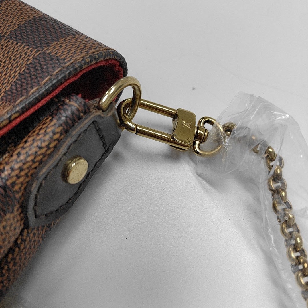 FAVORITE PM Damier Ebene Coated Canvas Brown