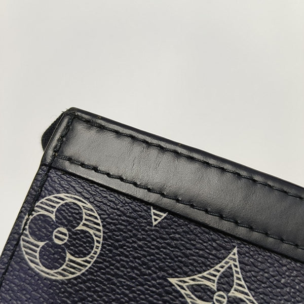 Pochette Voyag MM Monogram Coated Canvas Blue