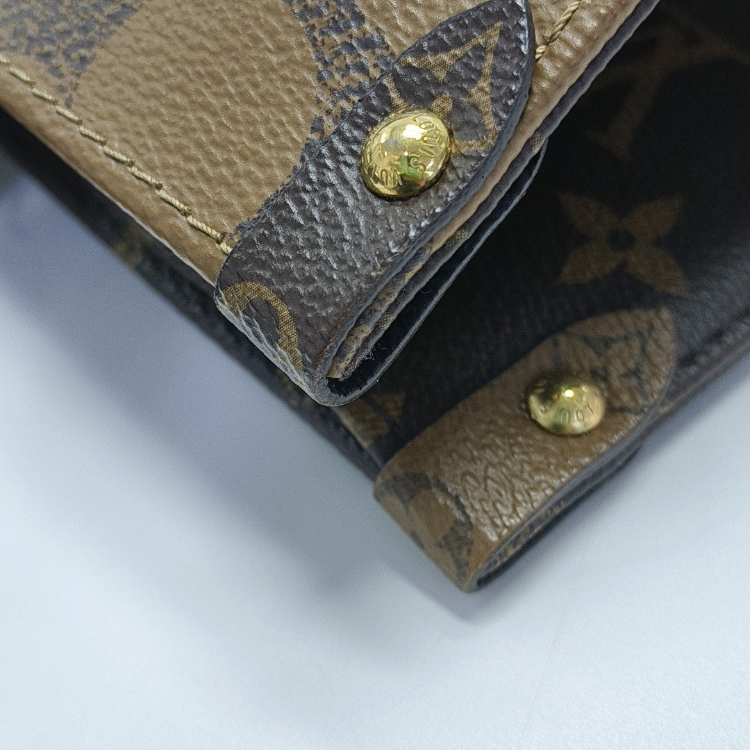 ONTHEGO MM Monogram Coated Canvas Brown
