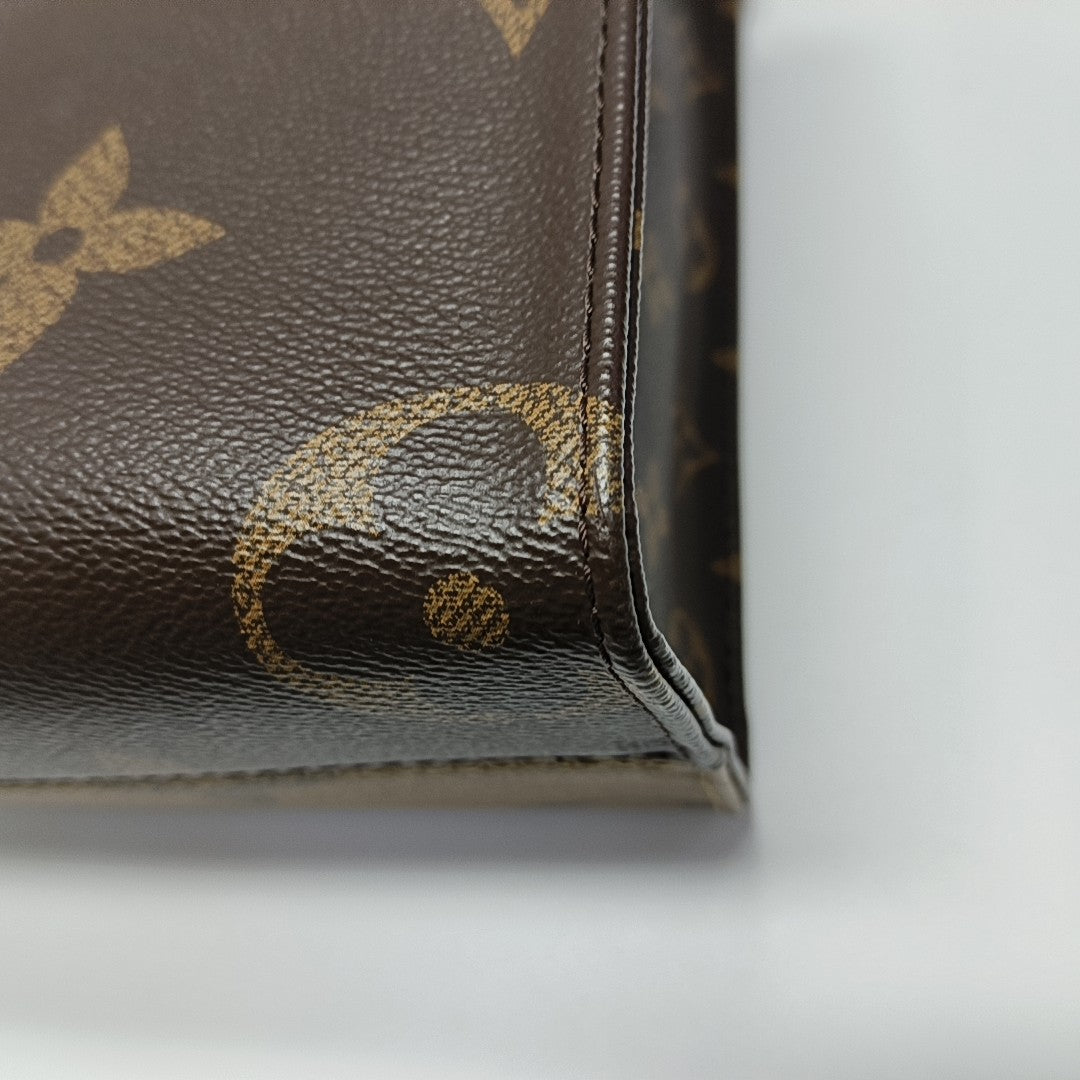 ONTHEGO PM Monogram Coated Canvas Brown