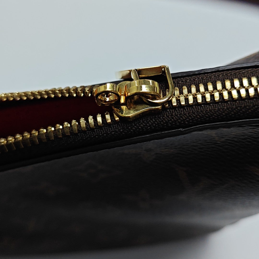 SLOUCHY PM Monogram Coated Canvas Brown