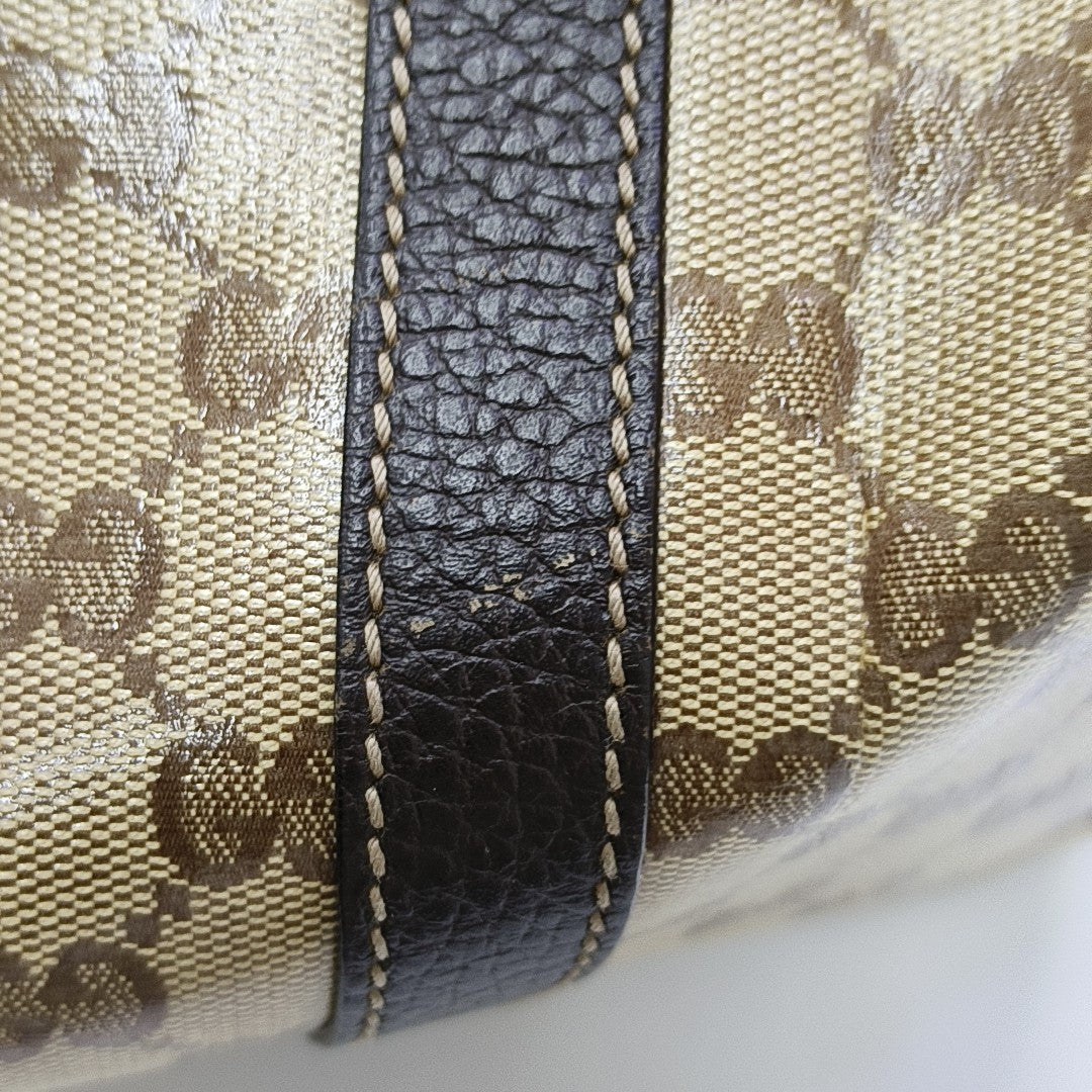Joy Medium Monogram Coated Canvas Brown