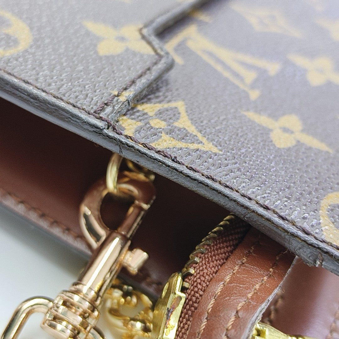 Monogram Coated Canvas Clutch Brown