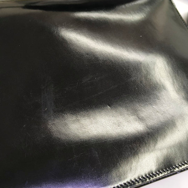 G entrelazada de charol negro grande